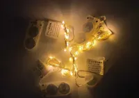 Lampki na druciku 10 LED Ciepłe światło (baterie CR2032) — ujęcie 2