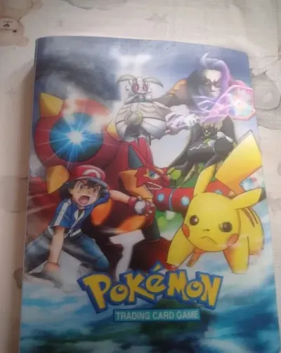 Album wraz z kartami pokemon — praca Wojciech M., Poznań